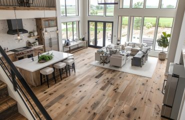 a large open concept kitchen and living room Hybrid vinyl flooring installed in a modern Melbourne living room with timber-look finish