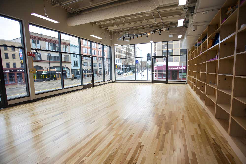 Commercial vinyl flooring samples and project plans being reviewed for a business fit-out